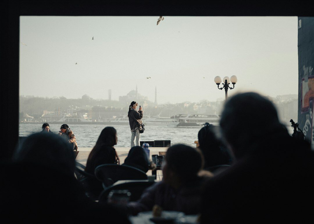 Turkish producer reviewing live broadcast footage on a monitor